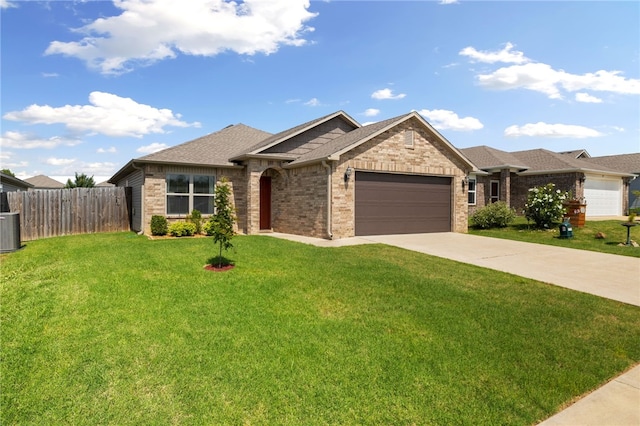 927 E Swift Dr, Fayetteville, AR 72701 - single story home with an attached garage, driveway, brick siding, and roof with shingles