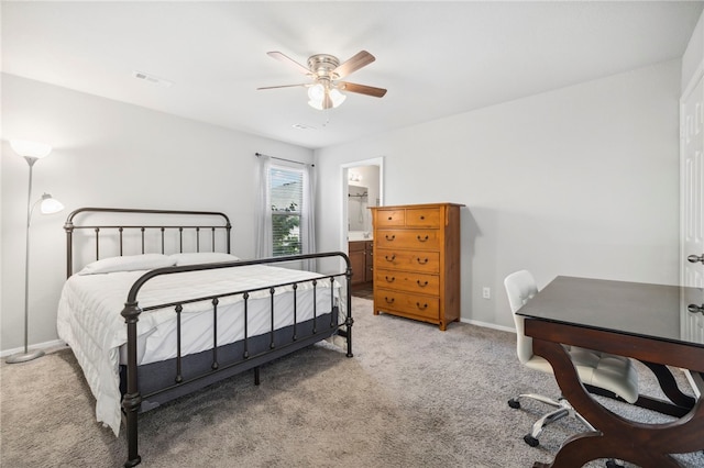 927 E Swift Dr, Fayetteville, AR 72701 - bedroom featuring light colored carpet, a ceiling fan, and connected bathroom