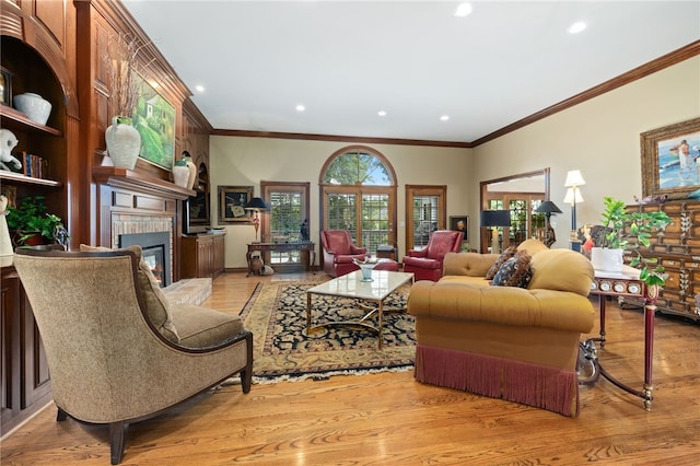 2 Canterbury Park, Bentonville, AR 72712 - living area featuring a glass covered fireplace, light wood-style flooring, crown molding, and recessed lighting