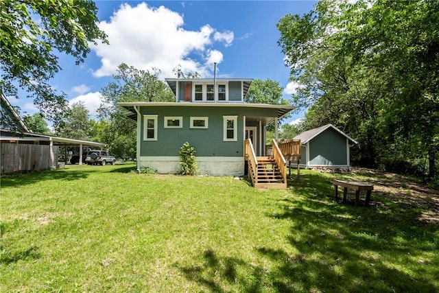 506 E Ashley St, Siloam Springs, AR 72761 - back of house featuring a yard and an outdoor structure