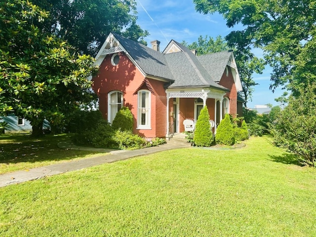 1016 S 4th St, Rogers, AR 72756 - victorian-style house featuring a front lawn and roof with shingles