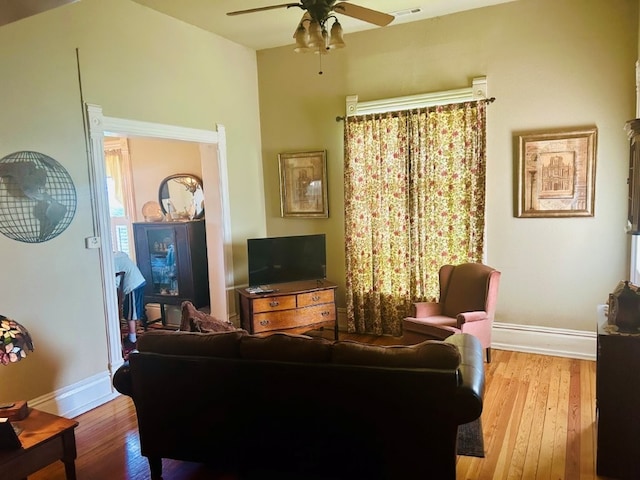 1016 S 4th St, Rogers, AR 72756 - living area featuring a ceiling fan and hardwood / wood-style flooring