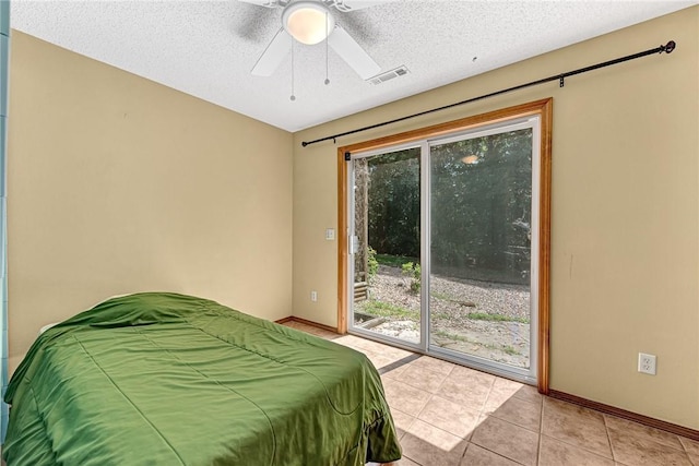 3 Prestwick Ln, Bella Vista, AR 72715 - bedroom featuring access to exterior, multiple windows, light tile patterned flooring, ceiling fan, and a textured ceiling