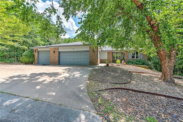 3 Prestwick Ln, Bella Vista, AR 72715 - view of front of property featuring brick siding, an attached garage, and driveway