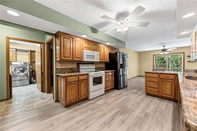 3 Prestwick Ln, Bella Vista, AR 72715 - kitchen featuring white appliances, washer / clothes dryer, a textured ceiling, a ceiling fan, and brown cabinets