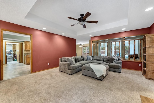 3 Prestwick Ln, Bella Vista, AR 72715 - living room with washer / dryer, a raised ceiling, a ceiling fan, light carpet, and recessed lighting
