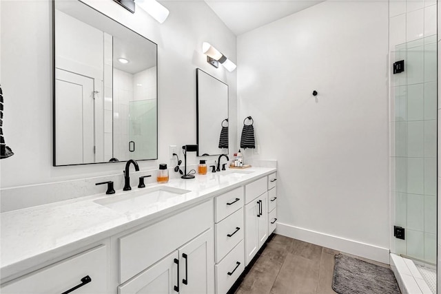 118 Briartown, Bentonville, AR 72712 - full bathroom with double vanity, a shower stall, and wood finished floors
