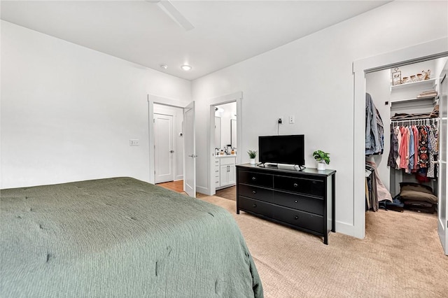 118 Briartown, Bentonville, AR 72712 - bedroom featuring a spacious closet, a closet, light colored carpet, ensuite bath, and a ceiling fan