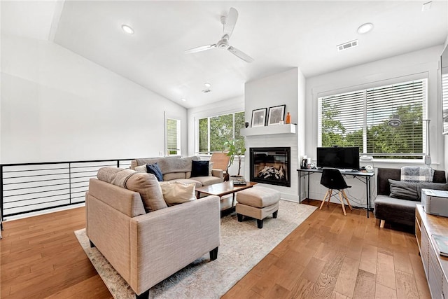 118 Briartown, Bentonville, AR 72712 - living area featuring a ceiling fan, lofted ceiling, light wood-type flooring, a glass covered fireplace, and recessed lighting