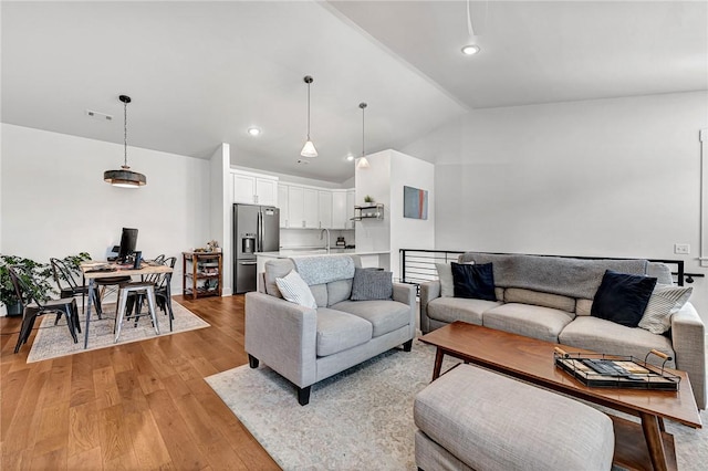 118 Briartown, Bentonville, AR 72712 - living room featuring vaulted ceiling, light wood-style floors, and recessed lighting