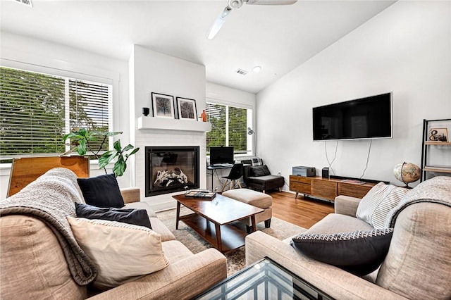 118 Briartown, Bentonville, AR 72712 - living area with ceiling fan, vaulted ceiling, wood finished floors, a glass covered fireplace, and recessed lighting