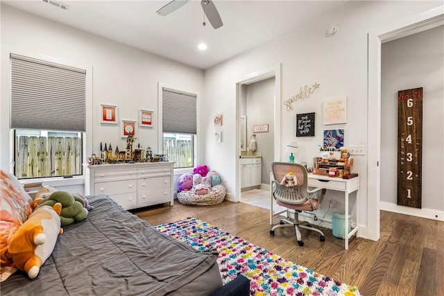 406 SW E St, Bentonville, AR 72712 - bedroom with wood finished floors, recessed lighting, connected bathroom, and ceiling fan