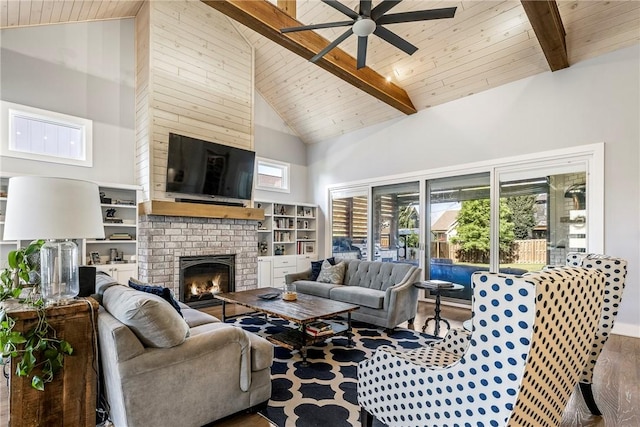 406 SW E St, Bentonville, AR 72712 - living area with high vaulted ceiling, ceiling fan, a wood ceiling with exposed beams, a brick fireplace, and wood finished floors