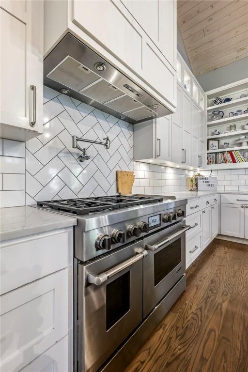 406 SW E St, Bentonville, AR 72712 - kitchen featuring double oven range, exhaust hood, white cabinets, open shelves, and light stone countertops