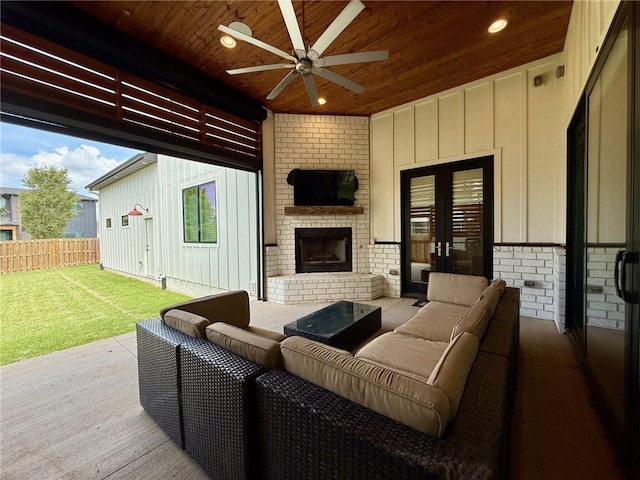 406 SW E St, Bentonville, AR 72712 - wooden deck with ceiling fan, an outdoor living space with a fireplace, and french doors