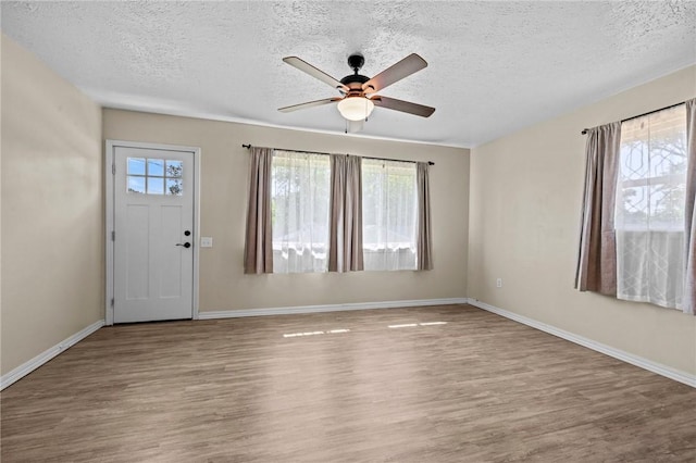 142 N Maple St, Cave Springs, AR 72718 - entrance foyer featuring ceiling fan, a textured ceiling, and wood finished floors