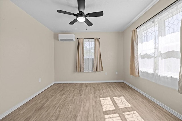 142 N Maple St, Cave Springs, AR 72718 - spare room with an AC wall unit, wood finished floors, and ceiling fan