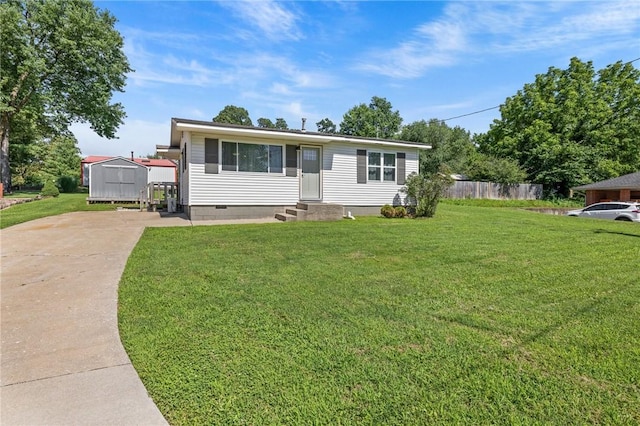 142 N Maple St, Cave Springs, AR 72718 - manufactured / mobile home with entry steps, concrete driveway, crawl space, and a storage unit