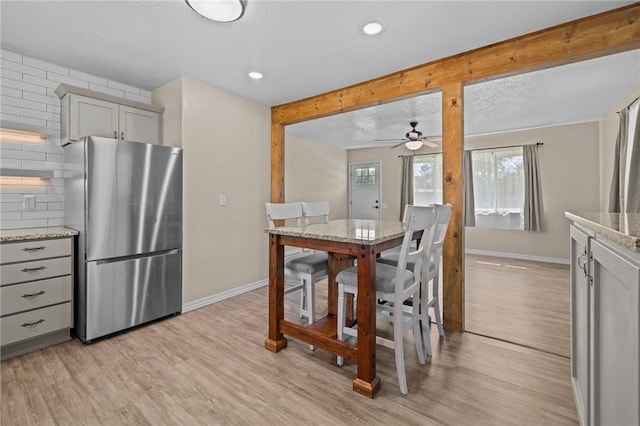 142 N Maple St, Cave Springs, AR 72718 - dining room with light wood-style floors, a ceiling fan, and recessed lighting
