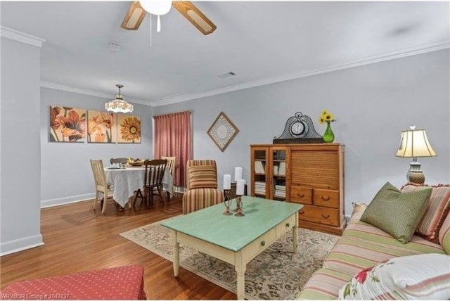 1107 S 20th St, Fort Smith, AR 72901 - living area featuring ornamental molding, a chandelier, wood finished floors, and ceiling fan