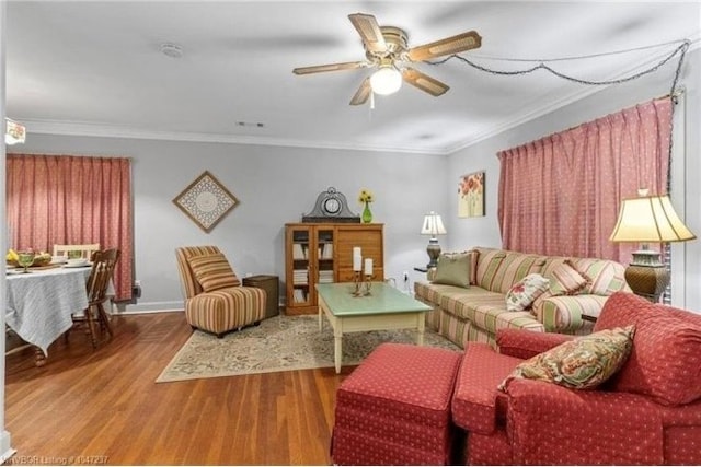 1107 S 20th St, Fort Smith, AR 72901 - living area featuring wood finished floors, a ceiling fan, and crown molding