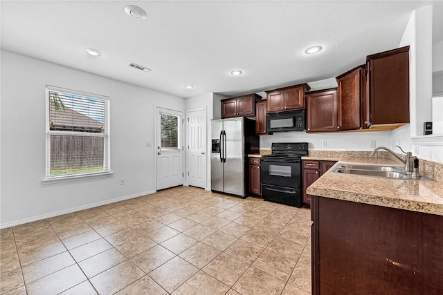 640 Spur Ln, Centerton, AR 72719 - kitchen with black appliances, light tile patterned floors, dark brown cabinetry, light countertops, and recessed lighting