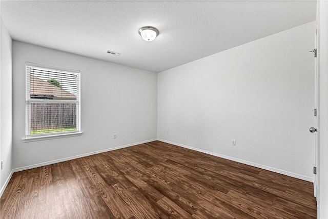 640 Spur Ln, Centerton, AR 72719 - unfurnished room featuring dark wood-style floors and baseboards