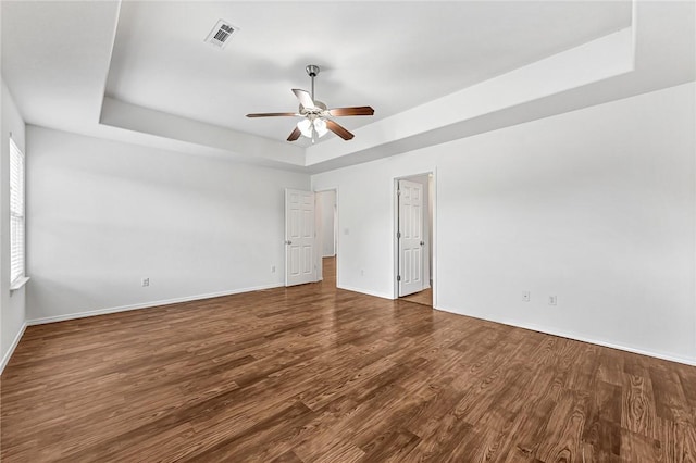 640 Spur Ln, Centerton, AR 72719 - unfurnished room featuring a tray ceiling, a ceiling fan, and wood finished floors