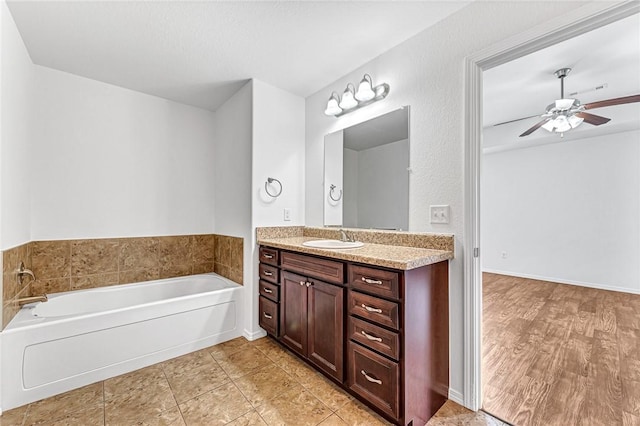 640 Spur Ln, Centerton, AR 72719 - full bath with vanity, a bath, and ceiling fan