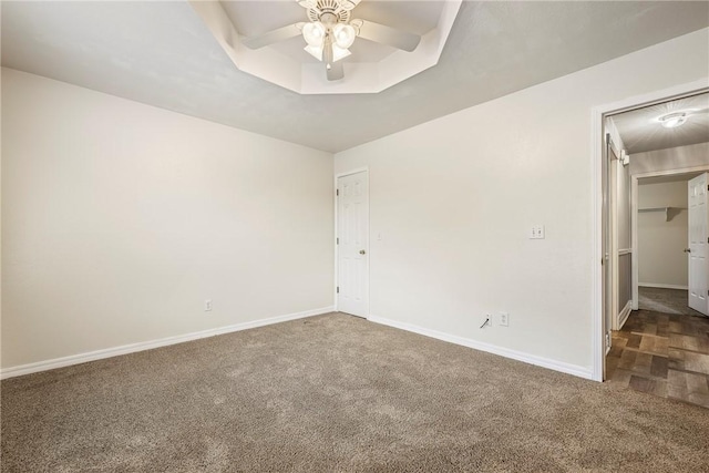 3310 Colton Dr, Springdale, AR 72762 - carpeted spare room featuring ceiling fan and a raised ceiling