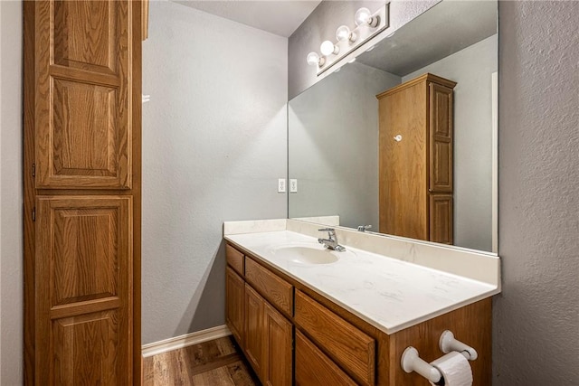 3310 Colton Dr, Springdale, AR 72762 - bathroom with vanity, wood finished floors, and a textured wall