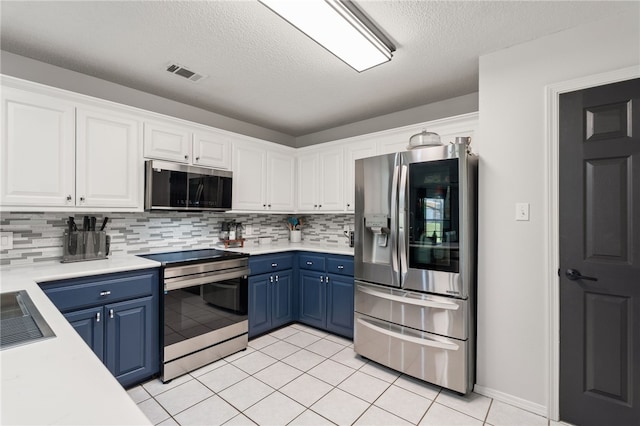 146 Horizon Ln, Alma, AR 72921 - kitchen with appliances with stainless steel finishes, blue cabinets, white cabinets, light countertops, and a textured ceiling