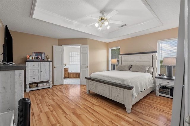 146 Horizon Ln, Alma, AR 72921 - bedroom with a raised ceiling, light wood-style floors, multiple windows, crown molding, and ensuite bathroom