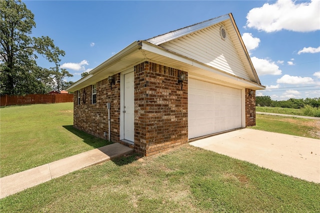 146 Horizon Ln, Alma, AR 72921 - view of side of home with brick siding, a detached garage, and an outbuilding