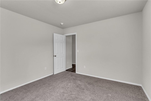 2304 Maplewood Dr, Lowell, AR 72745 - carpeted empty room with baseboards