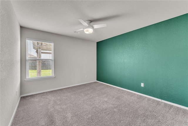 2304 Maplewood Dr, Lowell, AR 72745 - carpeted spare room featuring ceiling fan and a textured wall