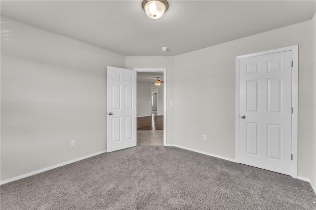 2304 Maplewood Dr, Lowell, AR 72745 - unfurnished bedroom featuring carpet and baseboards