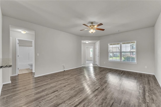 2304 Maplewood Dr, Lowell, AR 72745 - unfurnished living room featuring wood finished floors and a ceiling fan