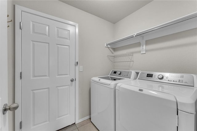 2304 Maplewood Dr, Lowell, AR 72745 - laundry room with separate washer and dryer and light tile patterned floors