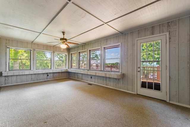 8073 Old White River Rd, Rogers, AR 72756 - unfurnished sunroom with plenty of natural light, carpet, and wood walls