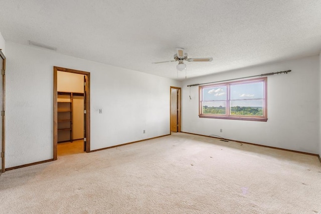 8073 Old White River Rd, Rogers, AR 72756 - carpeted empty room with ceiling fan and a textured ceiling