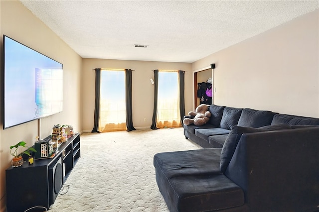 614 Beaconsfield Rd, Sherwood, AR 72120 - living area with carpet flooring and a textured ceiling