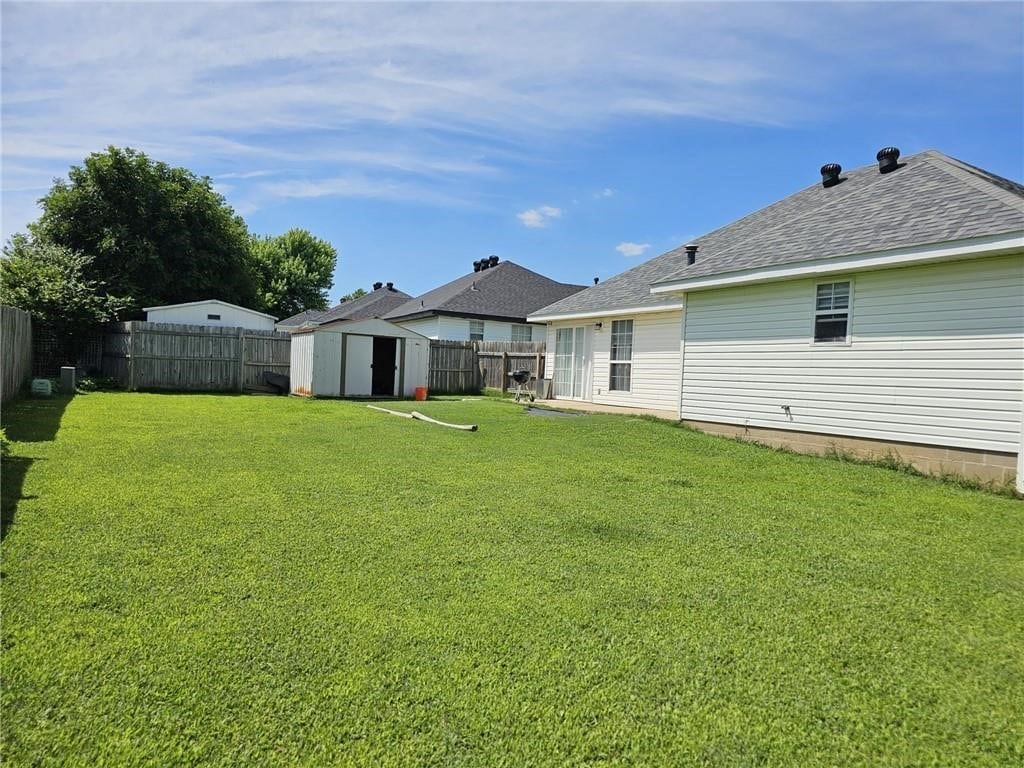 3028 Orchard St, Springdale, AR 72764 - fenced backyard with a shed