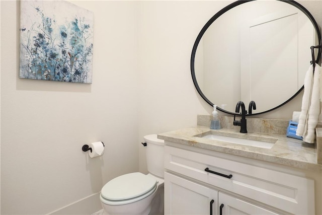 837-839 N Gregg Ave, Fayetteville, AR 72701 - half bath featuring vanity and toilet