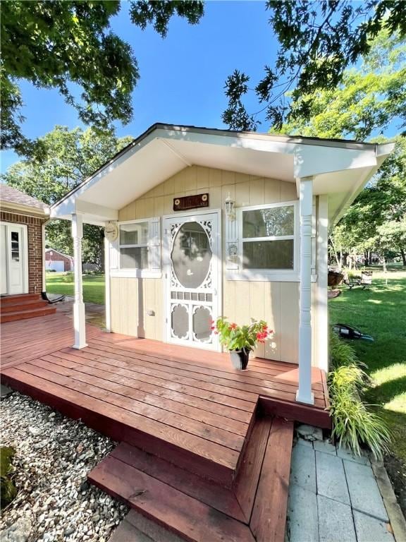 6 Hillcrest Dr, Holiday Island, AR 72631 - wooden deck with an outbuilding and a lawn