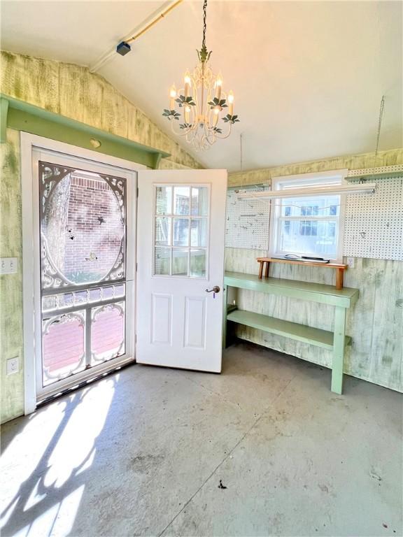 6 Hillcrest Dr, Holiday Island, AR 72631 - foyer with a chandelier, unfinished concrete flooring, and vaulted ceiling