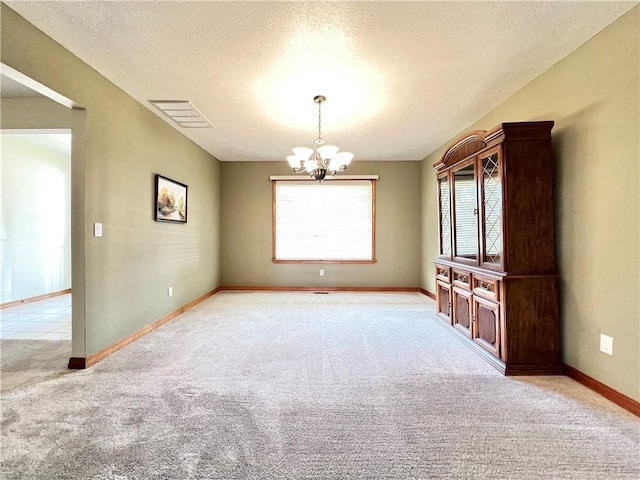 6 Hillcrest Dr, Holiday Island, AR 72631 - spare room featuring a chandelier, light carpet, and a textured ceiling