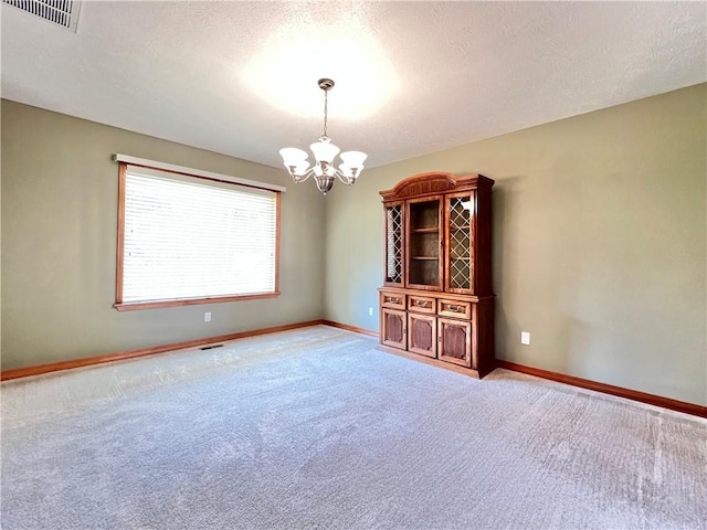6 Hillcrest Dr, Holiday Island, AR 72631 - unfurnished room featuring a chandelier and light colored carpet