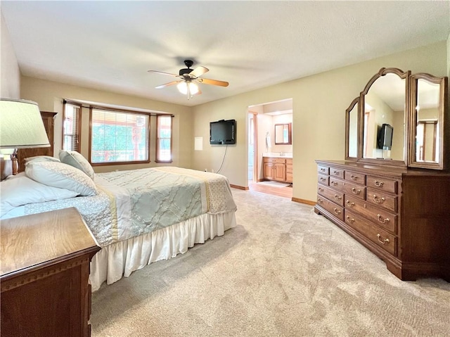 6 Hillcrest Dr, Holiday Island, AR 72631 - bedroom with light colored carpet, a ceiling fan, and ensuite bathroom