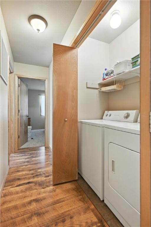 22562 Air Park, Golden, MO 65658 - laundry area featuring washer and dryer and light wood-type flooring